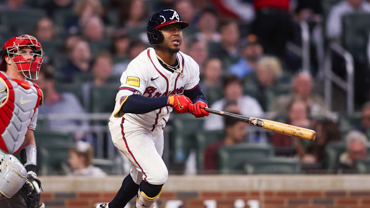 Apr 8, 2025; Atlanta, Georgia, USA; Atlanta Braves second baseman Ozzie Albies (1) hits a double against the Philadelphia Phillies in the third inning at Truist Park. Mandatory Credit: Brett Davis-Imagn Images