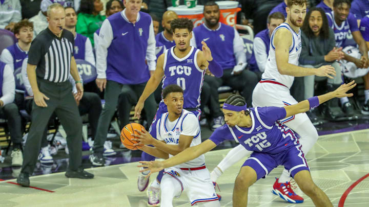 TCU's David Punch and Brendan Wenzel defend the basket in the Horned Frogs' loss last week to the Kansas Jayhawks.