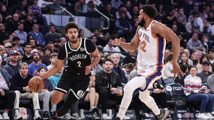 Nov 17, 2024; New York, New York, USA;  Brooklyn Nets forward Cameron Johnson (2) looks to drive past New York Knicks center Karl-Anthony Towns (32) in the first quarter at Madison Square Garden. Mandatory Credit: Wendell Cruz-Imagn Images
