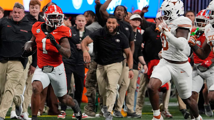 Georgia running back Trevor Etienne (1) breaks away for a big gain during the second half of the SEC championship game against Texas in Atlanta, on Saturday, Dec. 7, 2024. Georgia running back Trevor Etienne (1) breaks away for a big gain during the second half of the SEC championship game against Texas in Atlanta, on Saturday, Dec. 7, 2024.
