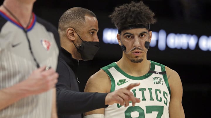 Apr 10, 2022; Memphis, Tennessee, USA; Boston Celtics head coach Ime Udoka (right) talks with guard Brodric Thomas (97) during the second half against the Memphis Grizzlies at FedExForum. Mandatory Credit: Petre Thomas-Imagn Images