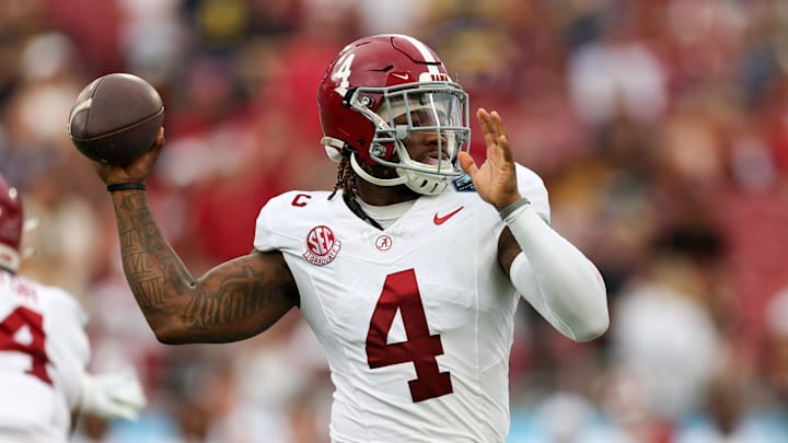 Dec 31, 2024; Tampa, FL, USA; Alabama Crimson Tide quarterback Jalen Milroe (4) drops back to pass against the Michigan Wolverines in the first quarter  during the ReliaQuest Bowl at Raymond James Stadium. Mandatory Credit: Nathan Ray Seebeck-Imagn Images