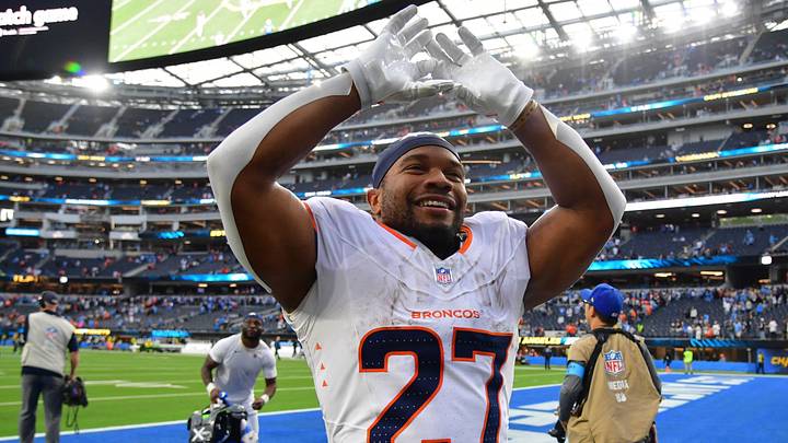 Denver Broncos running back J.K. Dobbins (27) celebrates after the game against the Los Angeles Chargers at SoFi Stadium.  Mandatory Credit: Gary A. Vasquez-Imagn Images
