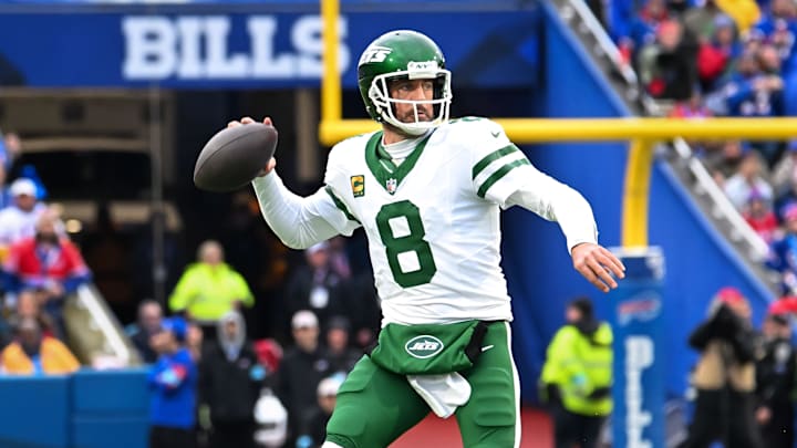 Dec 29, 2024; Orchard Park, New York, USA; New York Jets quarterback Aaron Rodgers (8) throws a pass in the first quarter against the Buffalo Bills at Highmark Stadium. Mandatory Credit: Mark Konezny-Imagn Images