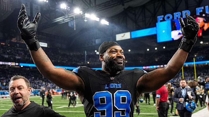 Detroit Lions defensive end Za'Darius Smith (99) celebrates 31-9 win over Minnesota Vikings as he exits the field at Ford Field in Detroit on Sunday, Jan. 5, 2025.