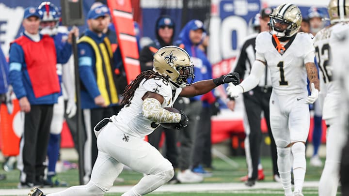 Dec 8, 2024; East Rutherford, New Jersey, USA; New Orleans Saints linebacker Demario Davis (56) celebrates his interception during the second half against the New York Giants at MetLife Stadium. Mandatory Credit: Vincent Carchietta-Imagn Images