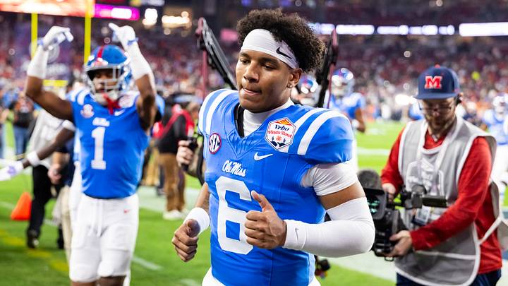 Jan 8, 2026; Glendale, AZ, USA; Mississippi Rebels quarterback Trinidad Chambliss (6) against the Miami Hurricanes during the 2026 Fiesta Bowl and semifinal game of the College Football Playoff at State Farm Stadium. Mandatory Credit: Mark J. Rebilas-Imagn Images Jan 8, 2026; Glendale, AZ, USA; Mississippi Rebels quarterback Trinidad Chambliss (6) against the Miami Hurricanes during the 2026 Fiesta Bowl and semifinal game of the College Football Playoff at State Farm Stadium. Mandatory Credit: Mark J. Rebilas-Imagn Images