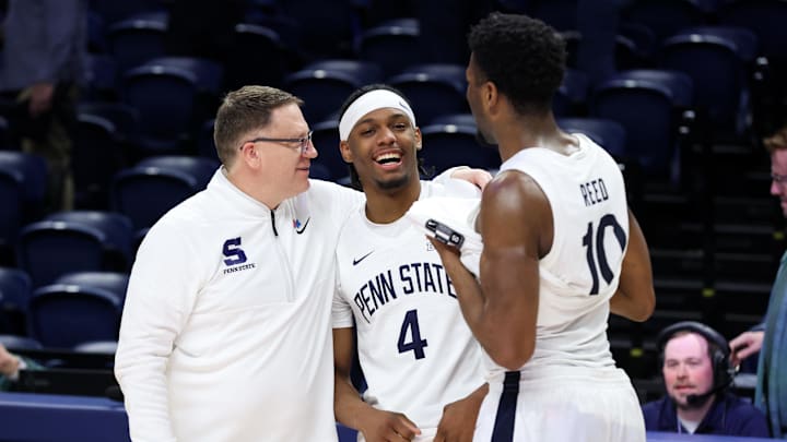 Penn State Nittany Lions head coach Mike Rhoades shares a moment with guard Kayden Mingo (4) and forward Josh Reed (10) following the game against the Iowa Hawkeyes at Bryce Jordan Center. Penn State Nittany Lions head coach Mike Rhoades shares a moment with guard Kayden Mingo (4) and forward Josh Reed (10) following the game against the Iowa Hawkeyes at Bryce Jordan Center.