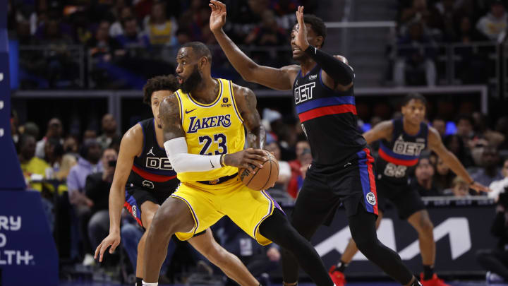 Nov 29, 2023; Detroit, Michigan, USA; Los Angeles Lakers forward LeBron James (23) is defended by