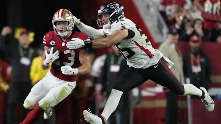 Oct 19, 2025; Santa Clara, California, USA; San Francisco 49ers running back Christian McCaffrey (23) runs the ball against Atlanta Falcons linebacker Kaden Elliss (55) during the fourth quarter at Levi's Stadium. Mandatory Credit: Kyle Terada-Imagn Images Oct 19, 2025; Santa Clara, California, USA; San Francisco 49ers running back Christian McCaffrey (23) runs the ball against Atlanta Falcons linebacker Kaden Elliss (55) during the fourth quarter at Levi's Stadium. Mandatory Credit: Kyle Terada-Imagn Images