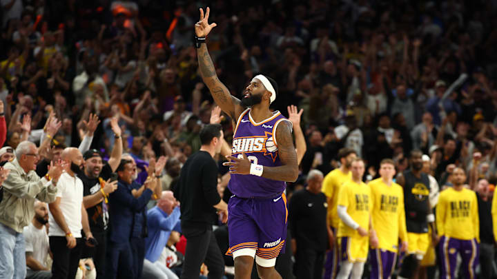 Feb 26, 2026; Phoenix, Arizona, USA; Phoenix Suns forward Royce O'Neale (00) celebrates the game winning shot against the Los Angeles Lakers in the second half at Mortgage Matchup Center. Mandatory Credit: Mark J. Rebilas-Imagn Images