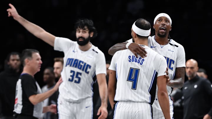 Dec 1, 2024; Brooklyn, New York, USA; Orlando Magic guard Kentavious Caldwell-Pope (3) embraces Orlando Magic guard Jalen Suggs (4) after scoring a basket against the Brooklyn Nets during the second half at Barclays Center. Mandatory Credit: John Jones-Imagn Images