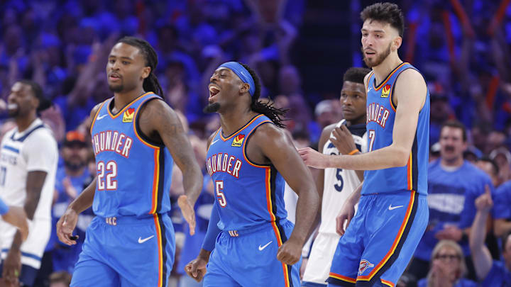 May 22, 2025; Oklahoma City, Oklahoma, USA; Oklahoma City Thunder guard Luguentz Dort (5) celebrates with guard Cason Wallace (22) and forward Chet Holmgren (7) after a play against the Minnesota Timberwolves in the third quarter during game two of the western conference finals for the 2025 NBA Playoffs at Paycom Center. Mandatory Credit: Alonzo Adams-Imagn Images
