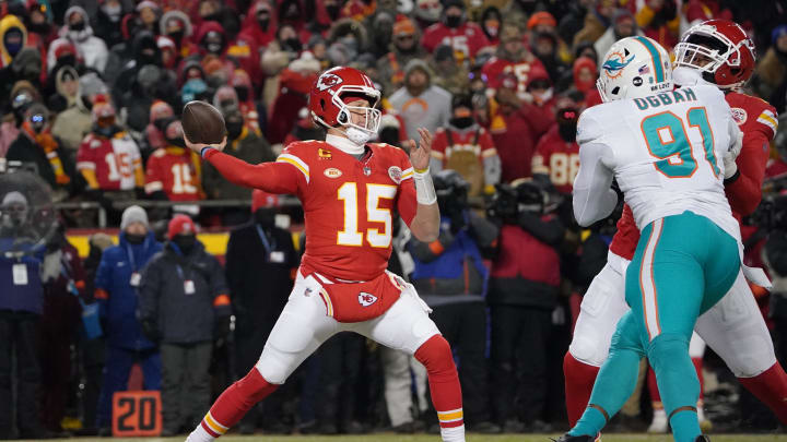 Jan 13, 2024; Kansas City, Missouri, USA; Kansas City Chiefs quarterback Patrick Mahomes (15) throws under pressure from Miami Dolphins defensive end Emmanuel Ogbah (91) during the first half of the 2024 AFC wild card game at GEHA Field at Arrowhead Stadium. Mandatory Credit: Denny Medley-USA TODAY Sports Jan 13, 2024; Kansas City, Missouri, USA; Kansas City Chiefs quarterback Patrick Mahomes (15) throws under pressure from Miami Dolphins defensive end Emmanuel Ogbah (91) during the first half of the 2024 AFC wild card game at GEHA Field at Arrowhead Stadium. Mandatory Credit: Denny Medley-USA TODAY Sports