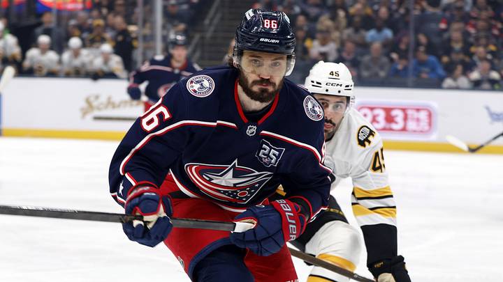 Apr 12, 2026; Columbus, Ohio, USA; Columbus Blue Jackets right wing Kirill Marchenko (86) and Boston Bruins defenseman Jonathan Aspirot (45) skate after a loose puck during the first period at Nationwide Arena. Mandatory Credit: Russell LaBounty-Imagn Images