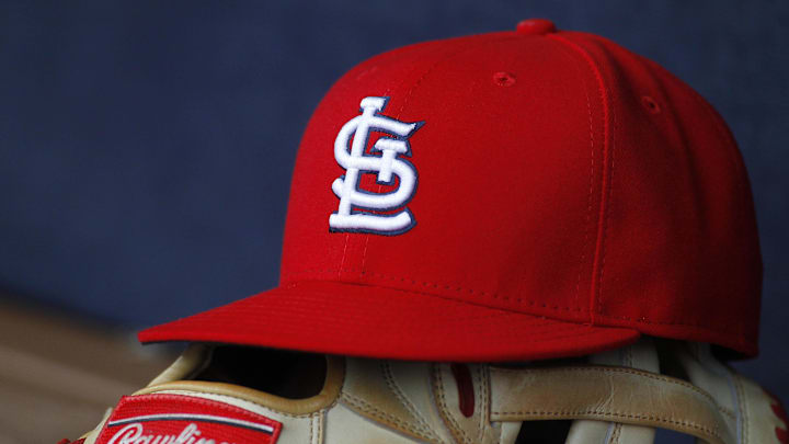 Oct 4, 2015; Atlanta, GA, USA; Detailed view of St. Louis Cardinals hat and glove in the dugout against the Atlanta Braves in the ninth inning at Turner Field. The Braves defeated the Cardinals 2-0. Mandatory Credit: Brett Davis-Imagn Images Oct 4, 2015; Atlanta, GA, USA; Detailed view of St. Louis Cardinals hat and glove in the dugout against the Atlanta Braves in the ninth inning at Turner Field. The Braves defeated the Cardinals 2-0. Mandatory Credit: Brett Davis-Imagn Images