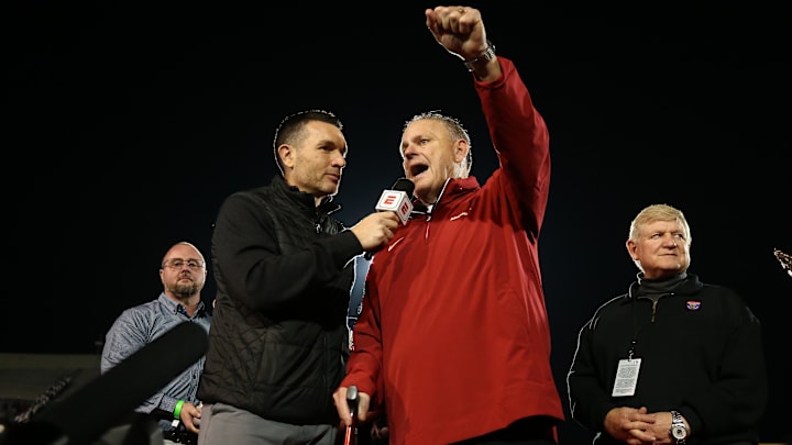 Arkansas Razorbacks coach Sam Pittman steadies himself on a cane during an interview after defeating the Texas Tech Red Raiders at Simmons Bank Liberty Stadium. 