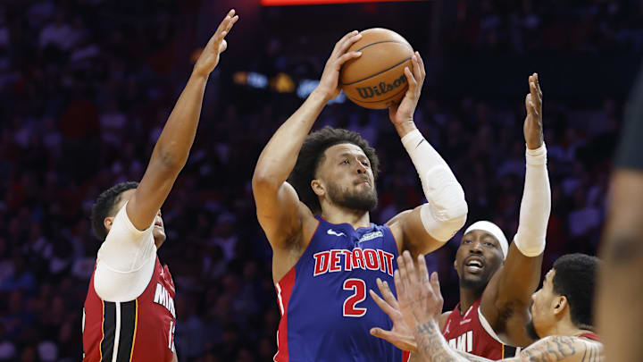 Mar 8, 2026; Miami, Florida, USA;  Miami Heat guard Dru Smith (12), center Bam Adebayo (13) and center Kel'el Ware (7) defend Detroit Pistons guard Cade Cunningham (2) during the second half at Kasey Center. Mandatory Credit: Rhona Wise-Imagn Images