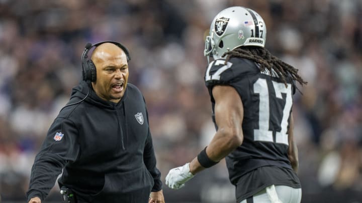 November 5, 2023; Paradise, Nevada, USA; Las Vegas Raiders interim head coach Antonio Pierce (left) high-fives wide receiver Davante Adams (17) after a touchdown against the New York Giants during the first quarter at Allegiant Stadium. Mandatory Credit: Kyle Terada-USA TODAY Sports