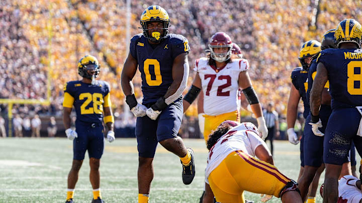 Michigan defensive end Josaiah Stewart (0) celebrates a tackle against USC during the first half at Michigan Stadium in Ann Arbor on Saturday, Sept. 21, 2024.