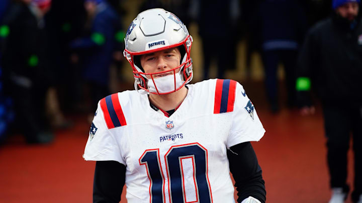 Dec 31, 2023; Orchard Park, New York, USA; New England Patriots quarterback Mac Jones (10) walks out to the field prior to the game against the Buffalo Bills at Highmark Stadium. Mandatory Credit: Gregory Fisher-Imagn Images Dec 31, 2023; Orchard Park, New York, USA; New England Patriots quarterback Mac Jones (10) walks out to the field prior to the game against the Buffalo Bills at Highmark Stadium. Mandatory Credit: Gregory Fisher-Imagn Images