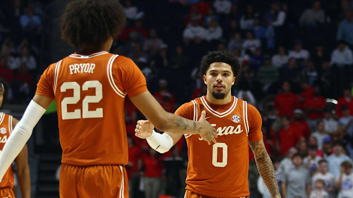 Jan 29, 2025; Oxford, Mississippi, USA; Texas Longhorns guard Jordan Pope (0) reacts with Texas Longhorns forward Devon Pryor (22) during the first half against the Mississippi Rebels at The Sandy and John Black Pavilion at Ole Miss. Mandatory Credit: Petre Thomas-Imagn Images