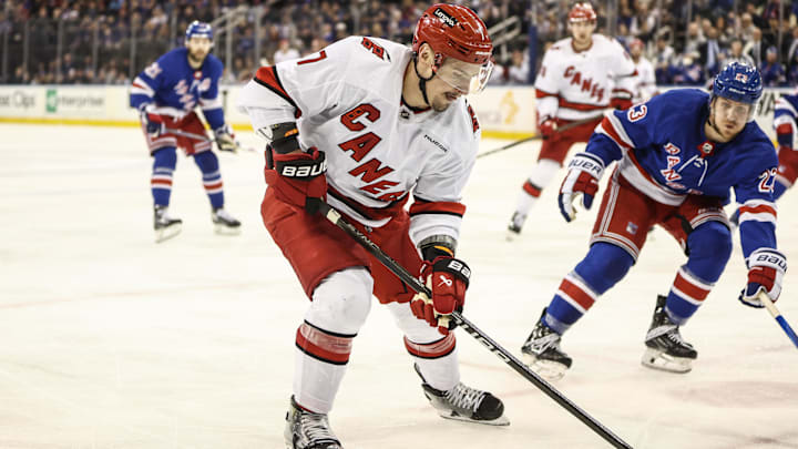 May 5, 2024; New York, New York, USA; Carolina Hurricanes defenseman Dmitry Orlov (7) controls the