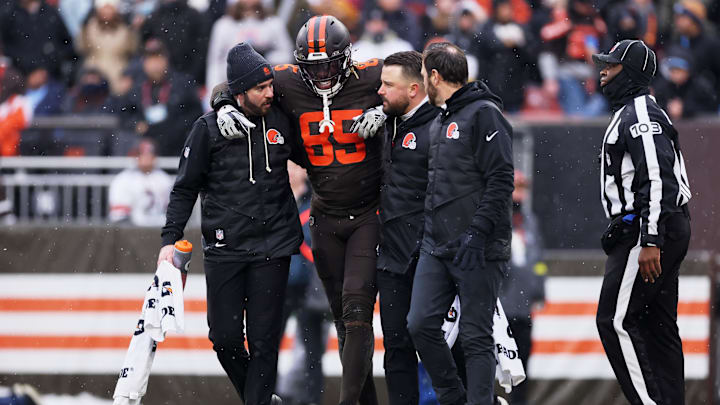 Dec 7, 2025; Cleveland, Ohio, USA; Cleveland Browns tight end David Njoku (85) is helped off of the field with an apparent injury against the Tennessee Titans during the second quarter at Huntington Bank Field. Mandatory Credit: Scott Galvin-Imagn Images