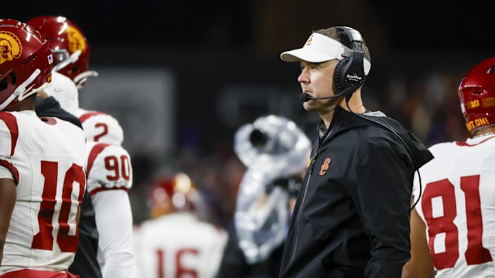 Nov 2, 2024; Seattle, Washington, USA; USC Trojans head coach Lincoln Riley stands on the sideline during the fourth quarter against the Washington Huskies at Alaska Airlines Field at Husky Stadium. Mandatory Credit: Joe Nicholson-Imagn Images Nov 2, 2024; Seattle, Washington, USA; USC Trojans head coach Lincoln Riley stands on the sideline during the fourth quarter against the Washington Huskies at Alaska Airlines Field at Husky Stadium. Mandatory Credit: Joe Nicholson-Imagn Images