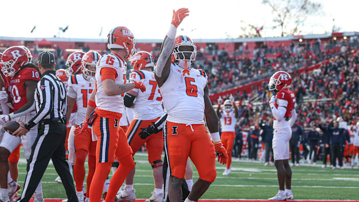 Nov 23, 2024; Piscataway, New Jersey, USA; Illinois Fighting Illini running back Josh McCray (6) celebrates his touchdown during the second half against the Rutgers Scarlet Knights at SHI Stadium. Mandatory Credit: Vincent Carchietta-Imagn Images