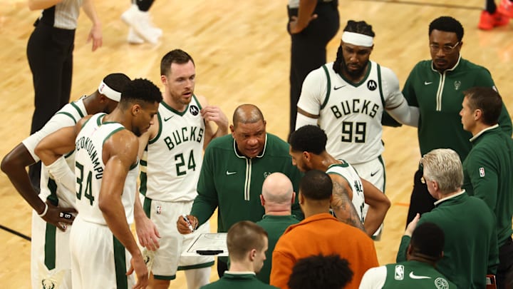 Feb 6, 2024; Phoenix, Arizona, USA; Milwaukee Bucks head coach Doc Rivers talks to forward Giannis Antetokounmpo (34) and teammates in the huddle against the Phoenix Suns at Footprint Center. Mandatory Credit: Mark J. Rebilas-Imagn Images
