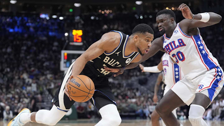 Jan 19, 2025; Milwaukee, Wisconsin, USA: Milwaukee Bucks forward Giannis Antetokounmpo (34) drives to the basket against Philadelphia 76ers center Adem Bona (30) in the first half at Fiserv Forum. Mandatory Credit: Michael McLoone-Imagn Images