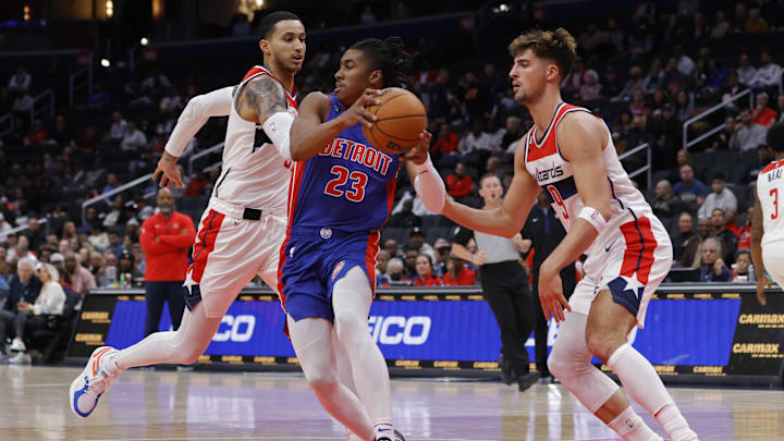 Oct 25, 2022; Washington, District of Columbia, USA; Detroit Pistons guard Jaden Ivey (23) dribbles the ball as Washington Wizards forward Deni Avdija (9) and Wizards forward Kyle Kuzma (33) defend in the second quarter at Capital One Arena. Mandatory Credit: Geoff Burke-Imagn Images Oct 25, 2022; Washington, District of Columbia, USA; Detroit Pistons guard Jaden Ivey (23) dribbles the ball as Washington Wizards forward Deni Avdija (9) and Wizards forward Kyle Kuzma (33) defend in the second quarter at Capital One Arena. Mandatory Credit: Geoff Burke-Imagn Images