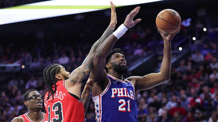 Mar 25, 2026; Philadelphia, Pennsylvania, USA; Philadelphia 76ers center Joel Embiid (21) drives for a shot against Chicago Bulls center Nick Richards (13) during the first quarter at Xfinity Mobile Arena. Mandatory Credit: Bill Streicher-Imagn Images