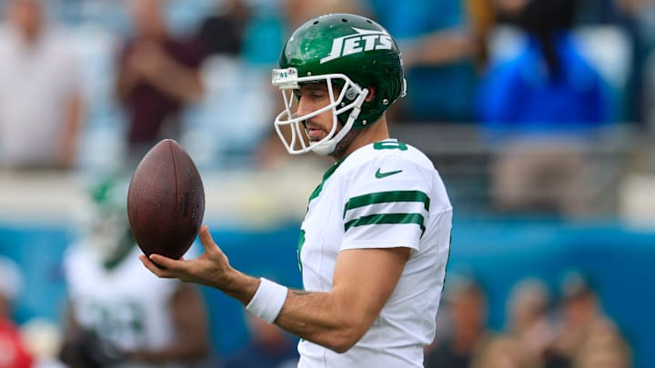 New York Jets quarterback Aaron Rodgers (8) balances a ball before an NFL football matchup Sunday, Dec. 15, 2024 at EverBank Stadium in Jacksonville, Fla. [Corey Perrine/Florida Times-Union]