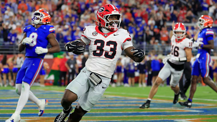 Georgia Bulldogs running back Chauncey Bowens (33) scores a touchdown during the fourth quarter of an NCAA football game, Saturday, Nov. 1, 2025, at EverBank Stadium in Jacksonville, Fla. Georgia held off Florida 24-20. [Corey Perrine/Florida Times-Union]