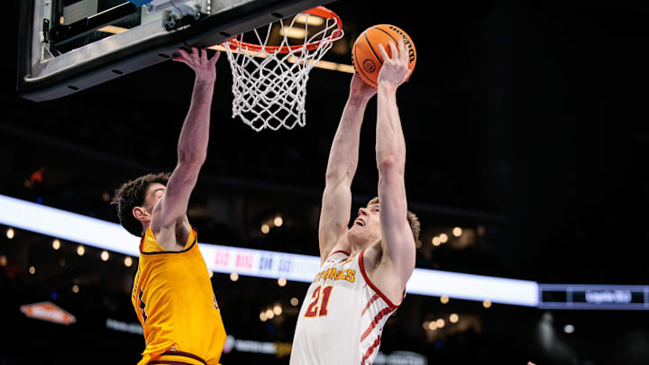 Mar 11, 2026; Kansas City, MO, USA; Iowa State Cyclones forward Dominykas Pleta (21) shoots the ball around Arizona State Sun Devils forward Santiago Trouet (1) during the first half at T-Mobile Center.