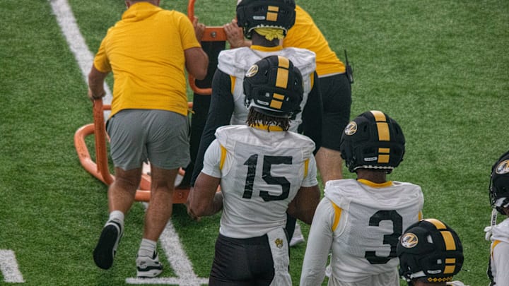 Aug 18, 2025; Columbia, MO, USA; Missouri Tigers safeties Santana Banner (15) and Mose Phillips III (3) line up for a fall camp practice drill.