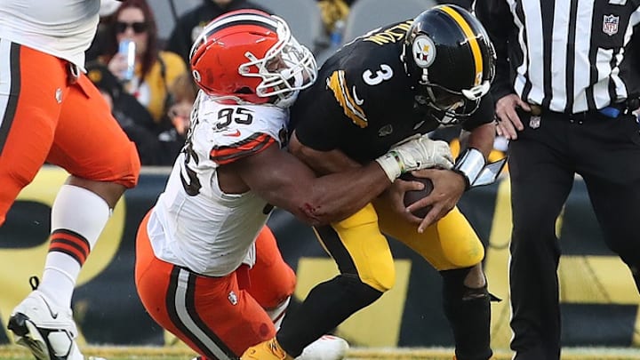 Dec 8, 2024; Pittsburgh, Pennsylvania, USA; Cleveland Browns defensive end Myles Garrett (95) sacks Pittsburgh Steelers quarterback Russell Wilson (3) during the fourth quarter at Acrisure Stadium. 