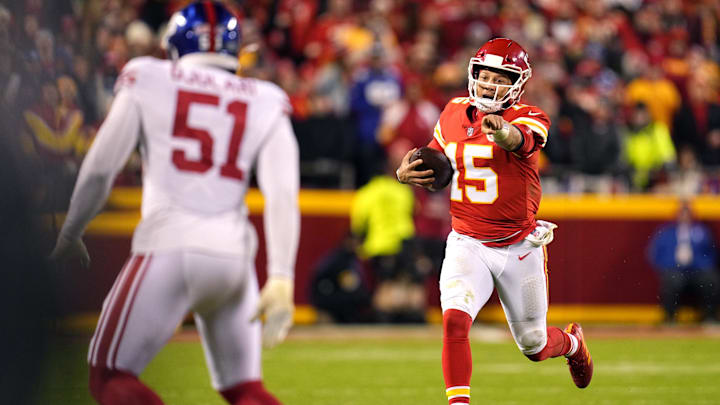 Nov 1, 2021; Kansas City, Missouri, USA; Kansas City Chiefs quarterback Patrick Mahomes (15) gestures as he runs with the ball as New York Giants outside linebacker Azeez Ojulari (51) defends during the second half at GEHA Field at Arrowhead Stadium. Mandatory Credit: Jay Biggerstaff-Imagn Images