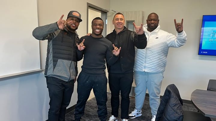 Javian Osborne (second from left) poses with Texas head coach Steve Sarkisian and Texas assistants Tashard Choice (left) and Chris Gilbert (right) during a visit at Forney High School.