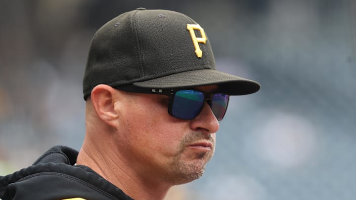 Sep 7, 2025; Pittsburgh, Pennsylvania, USA;  Pittsburgh Pirates manager Don Kelly (12) looks on from the dugout against the Milwaukee Brewers during the first inning at PNC Park. Mandatory Credit: Charles LeClaire-Imagn Images