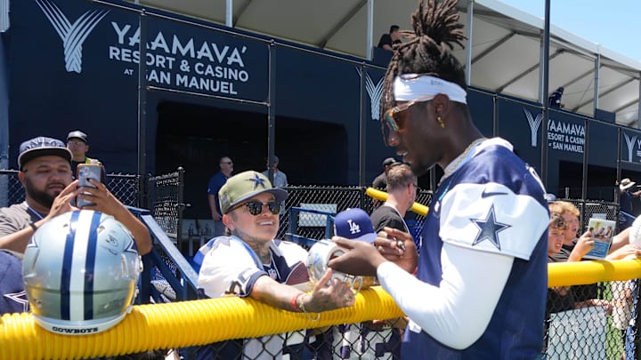 Dallas Cowboys linebacker DeMarvion Overshown signs autographs at training camp at the River Ridge Fields. Dallas Cowboys linebacker DeMarvion Overshown signs autographs at training camp at the River Ridge Fields.