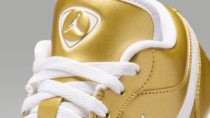 The Air Jordan 1 Low 'Gold Tiempo' colorway.