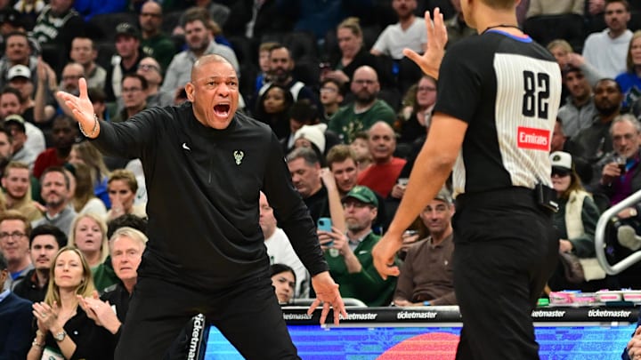 Feb 10, 2025; Milwaukee, Wisconsin, USA; Milwaukee Bucks head coach Doc Rivers talks to referee Suyash Mehta in the third quarter against the Golden State Warriors at Fiserv Forum. Mandatory Credit: Benny Sieu-Imagn Images