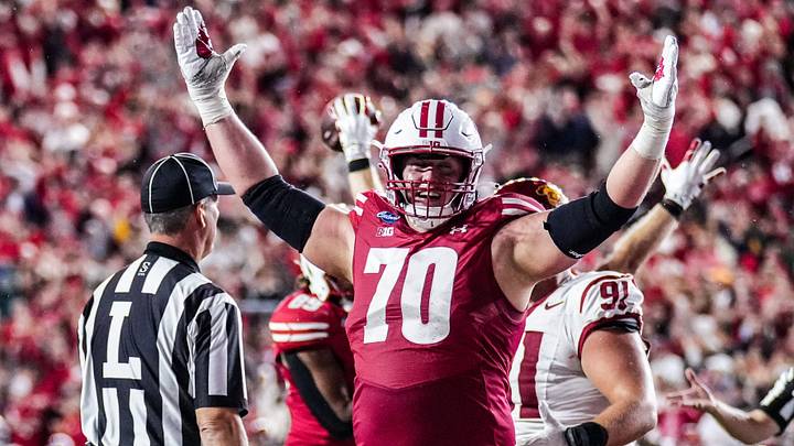 Wisconsin Badgers offensive lineman Barrett Nelson (70) celebrates a touchdown by tight end Ryan Schwendeman (84) during the game against USC, Oct. 24, 2026, at Camp Randall Stadium in Madison, Wisconsin. Wisconsin won the game, 24-7.