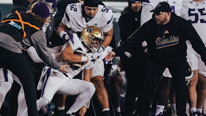 Michael Switzer tries to help quarterback Demond Williams Jr. get back on the field at Oregon. Michael Switzer tries to help quarterback Demond Williams Jr. get back on the field at Oregon.