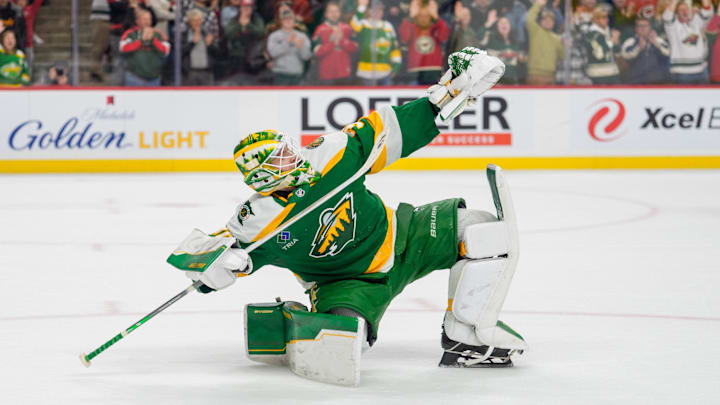 Nov 19, 2025; Saint Paul, Minnesota, USA; Minnesota Wild goaltender Jesper Wallstedt (30) celebrates after making the game winning save against Carolina Hurricanes left wing Taylor Hall (71) in the overtime shootout at Grand Casino Arena. Mandatory Credit: Matt Blewett-Imagn Images