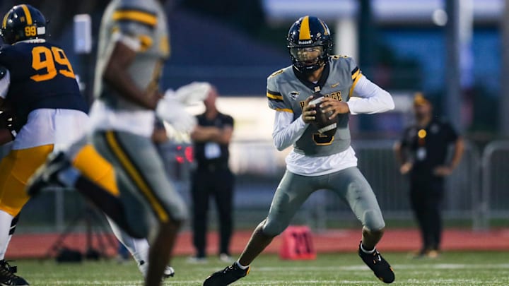 American Heritage Patriots quarterback Dia Bell (3) scrambles in the backfield during the first quarter of a game against the Naples Golden Eagles at Staver Field in Naples on Friday, Sept. 13, 2024.