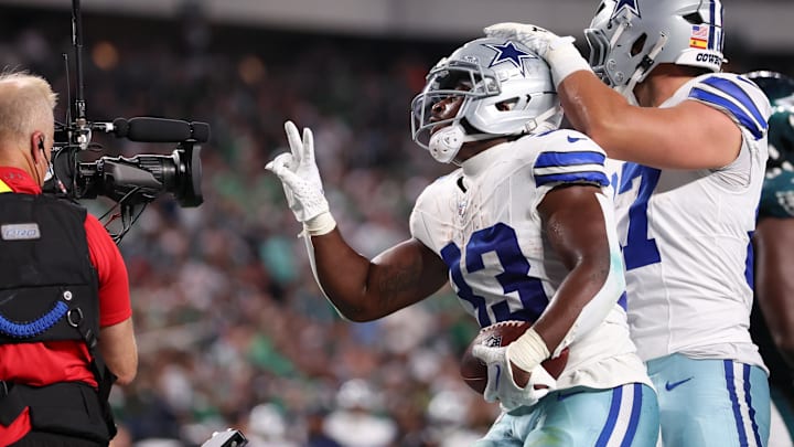 Sep 4, 2025; Philadelphia, Pennsylvania, USA; Dallas Cowboys running back Javonte Williams (33) celebrates with his teammates after scoring a touchdown against the Philadelphia Eagles during the first quarter of the game at Lincoln Financial Field. Mandatory Credit: Bill Streicher-Imagn Images
